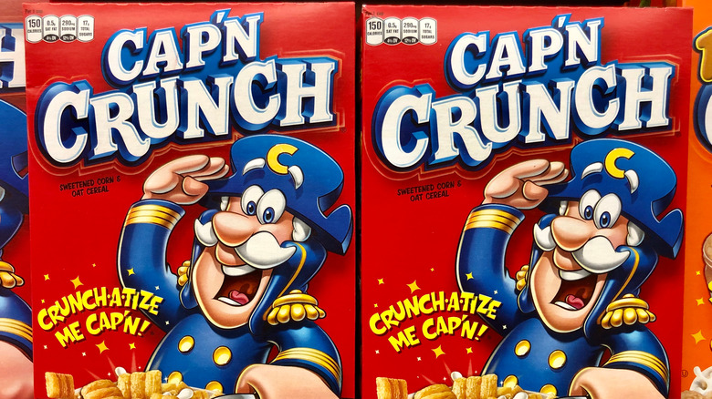 A close up of boxes of Quaker's Cap'n Crunch cereal