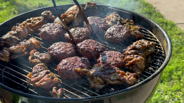 Meat getting charred on grill