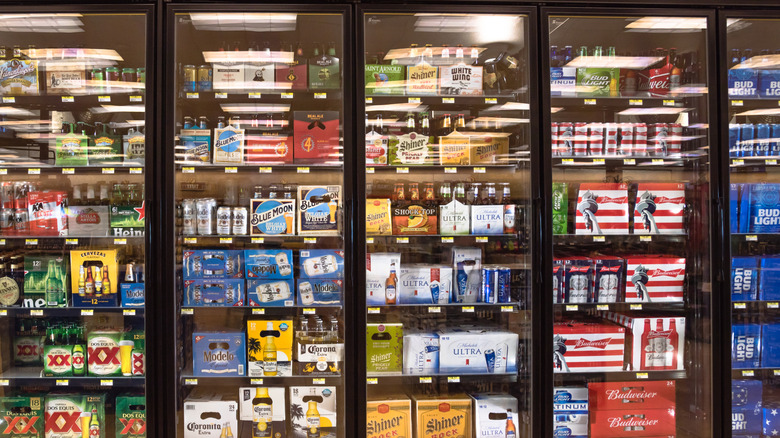 Various beers in grocery store refrigerators