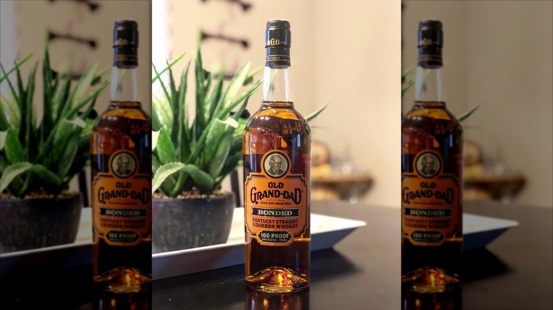 Bottle of Old Grand-Dad Bourbon sitting on a countertop