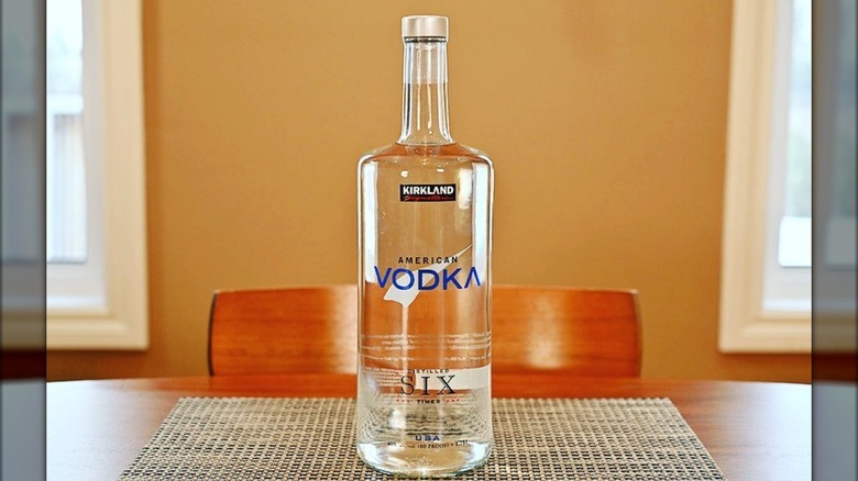 Bottle of Kirkland signature vodka on dining room table