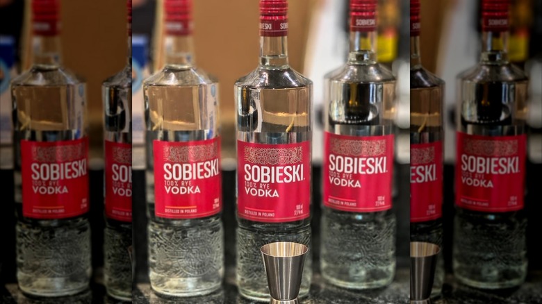 Three bottles of sobieski vodka on countertop