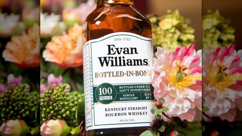 Evan Williams White Bottled-in-Bond bottle on a flower background