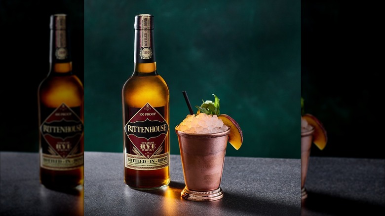 Rittenhouse Rye botte with a cocktail in a coppoer mug
