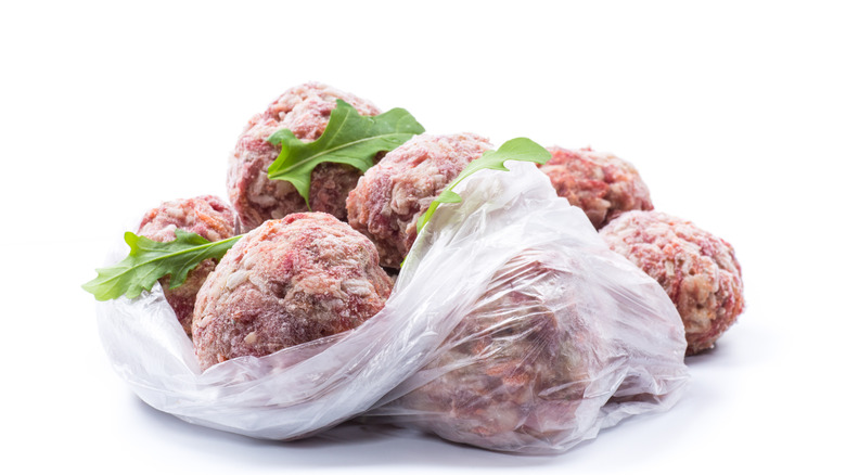 Frozen meatballs on a white background.
