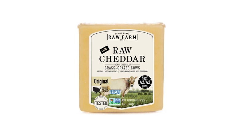A block of Raw Farm Raw Cheddar.