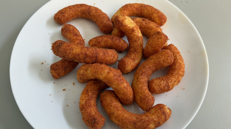 A white plate of Cheetos Sweet Phantom Heat puffs