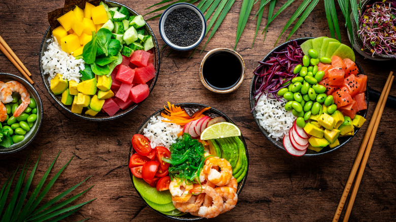 Top view of three different poke bowls