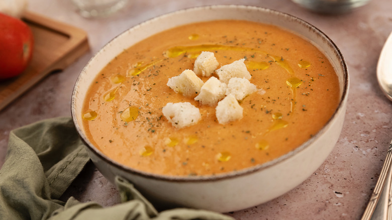 Bowl of gazpacho with pieces of bread