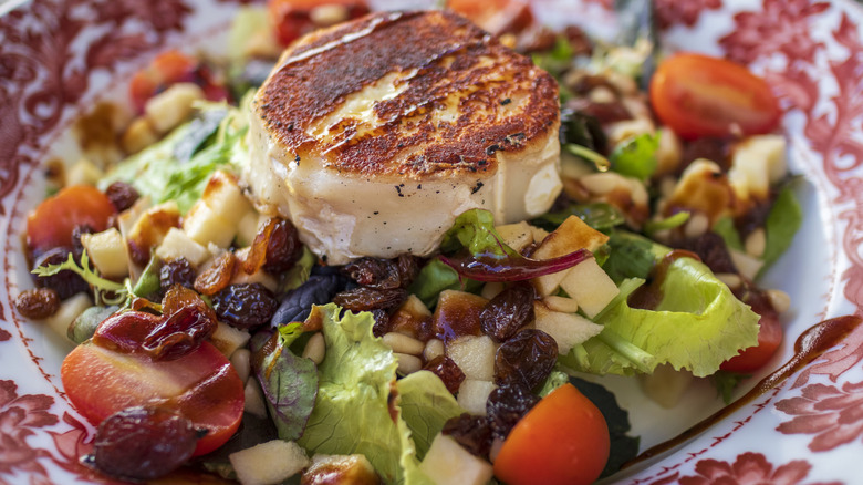 Cooked goat cheese on salad