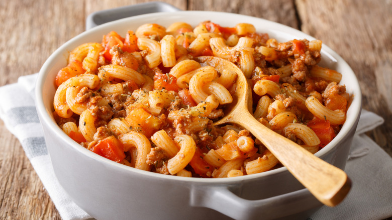 Bowl of American goulash with spoon