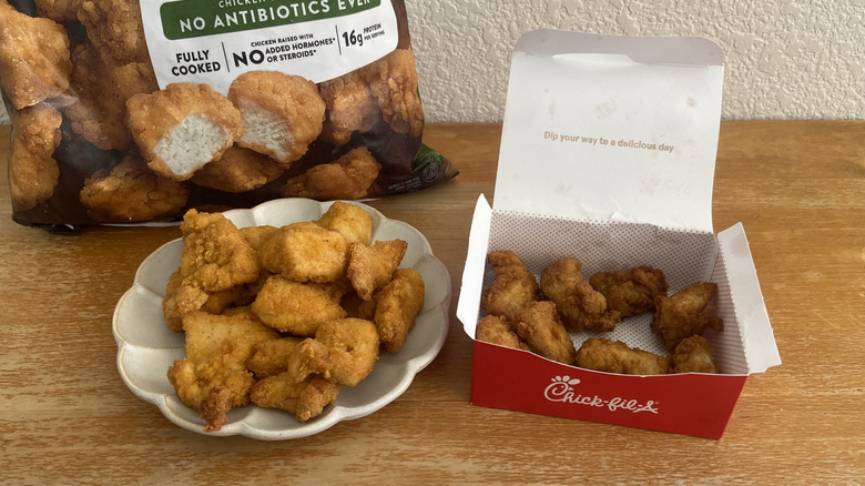 Costco nuggets on a small plate in front of their bag beside Chick-fil-A nugget box