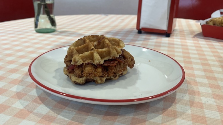 Chick-fil-A's Chicken and Waffle Sandwich is sitting on a plate