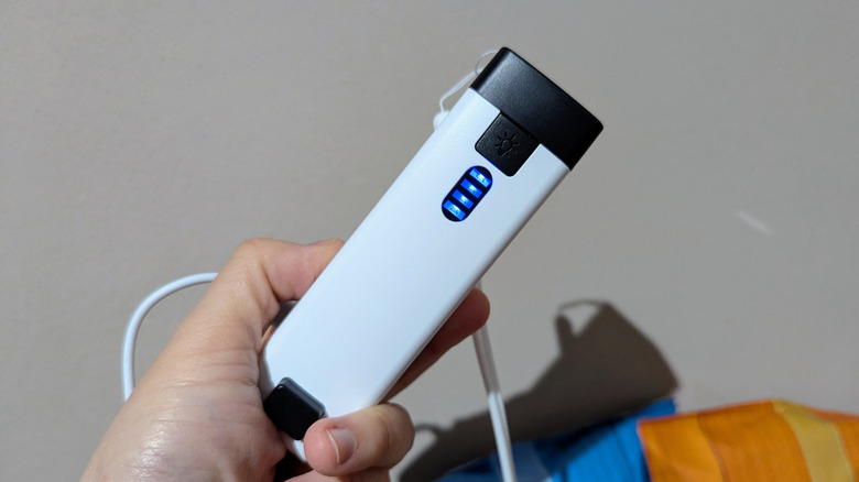 hand holding bag sealer