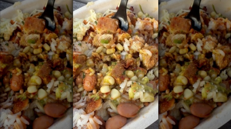 A closeup of a burrito bowl with Chipotle's new fried chicken.