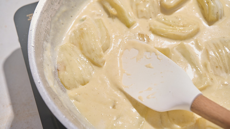 thickened cream sauce on a spatula