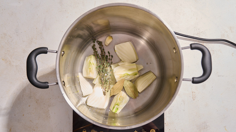 simmering water and aromatics in a pot