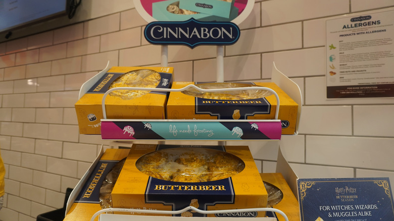 Boxes of Cinnabon Butterbeer-flavored Classic Rolls on display in a Cinnabon store