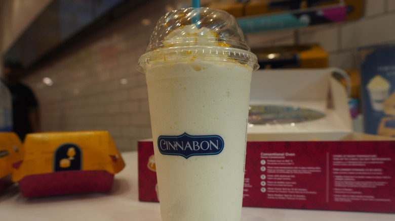 A close-up shot of Cinnabon Butterbeer-flavored Chillata in a Cinnabon store
