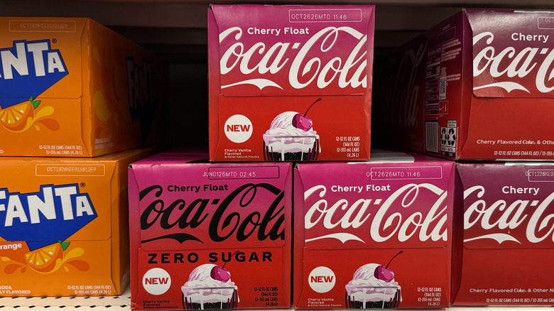 12-packs of Coke on a shelf