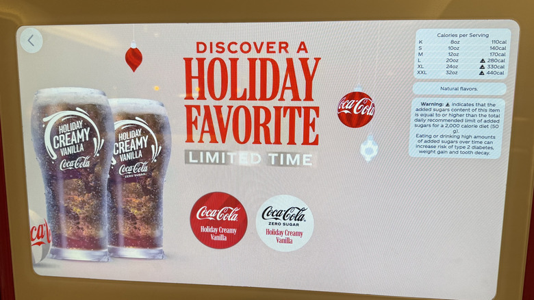 Coca-Cola Freestyle machine displaying images of Holiday Creamy Vanilla and calorie information