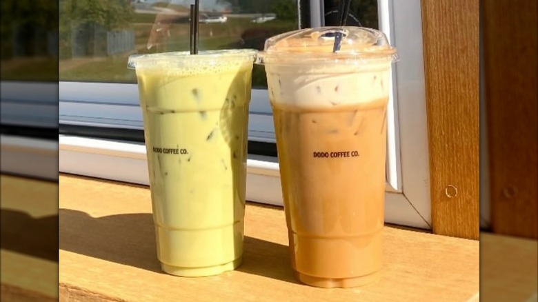 Two clear to-go cups of iced coffees on outdoor counter of Dodo Coffee Co. mobile coffee truck, co-founded by Cooper Kupp