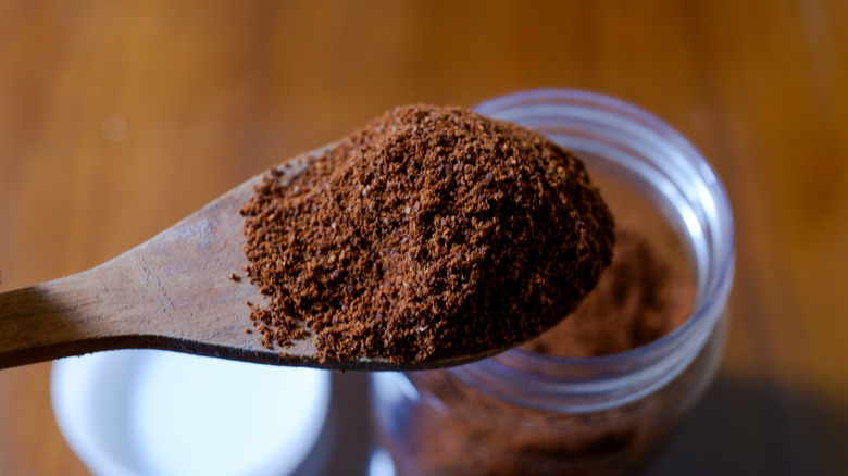 Close-up of a spoonful of coffee grounds