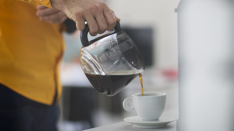 coffee pot pouring coffee