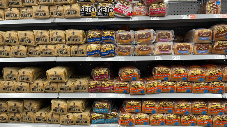 Various bread brands on shelf at grocery store