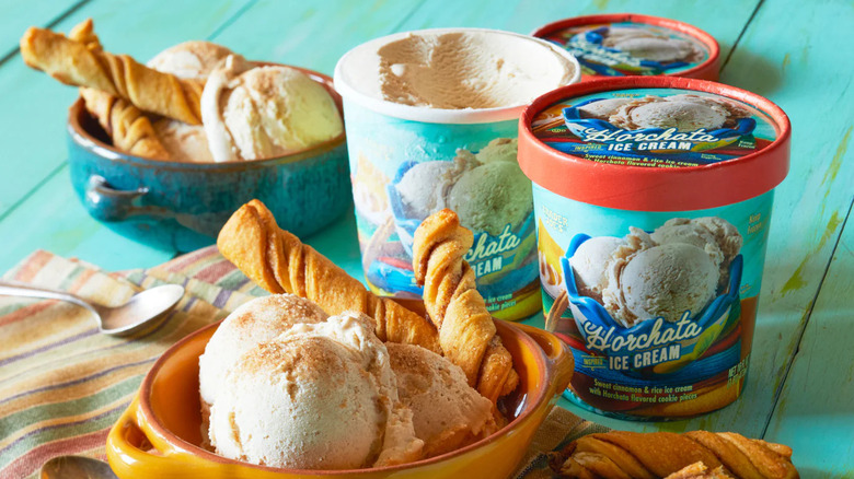 Trader Joe's Horchata Ice Cream carton next to bowl with churros and ice cream