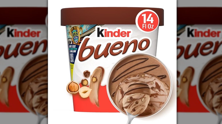 brown carton of Kinder Bueno hazelnut ice cream with a closeup of spoon scooping up dessert