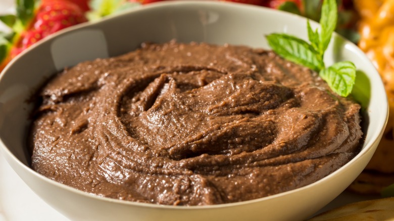Bowl filled with homemade brownie batter hummus