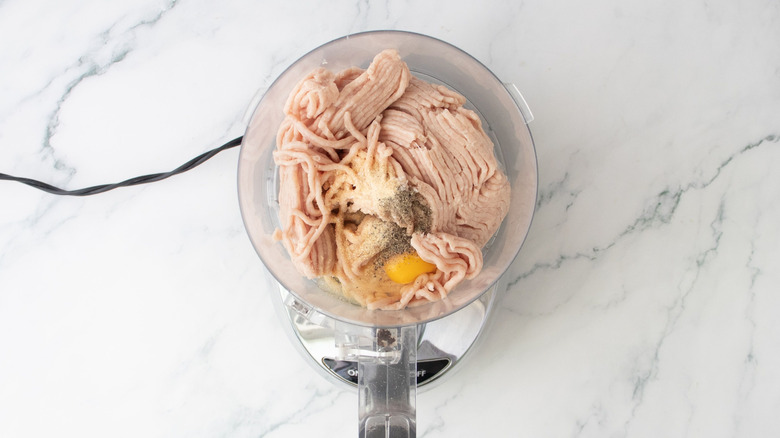 Ground chicken, egg, and seasonings in food processor
