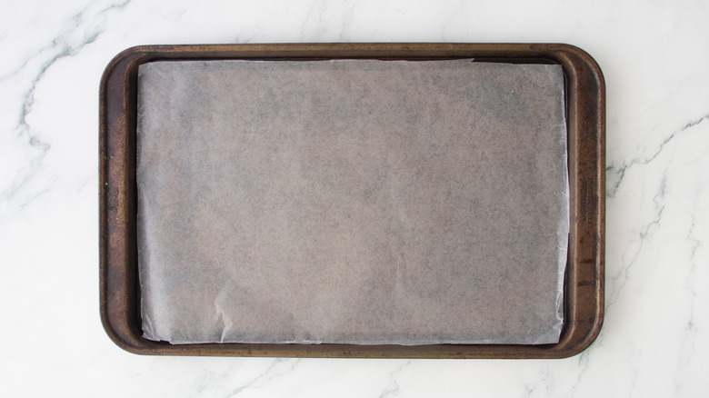 Baking sheet lined with wax paper