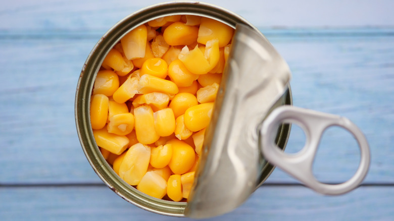 Can of corn being opened