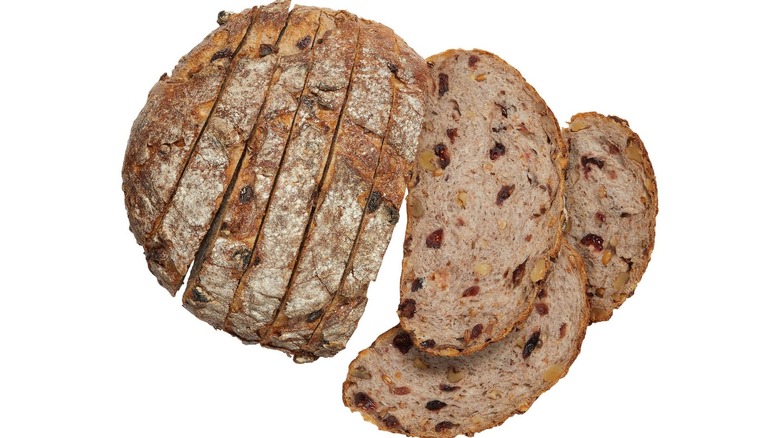 Kirkland Signature Cranberry Walnut Round Bread slices on white background