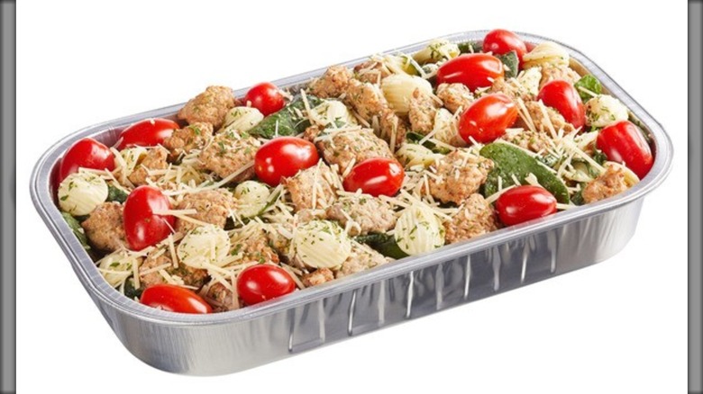 Kirkland Signature Italian Sausage and Pasta in Wine Sauce on a white background.