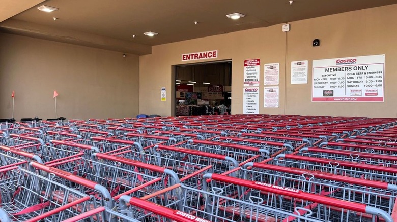 Costco carts lined up outside warehouse entrance