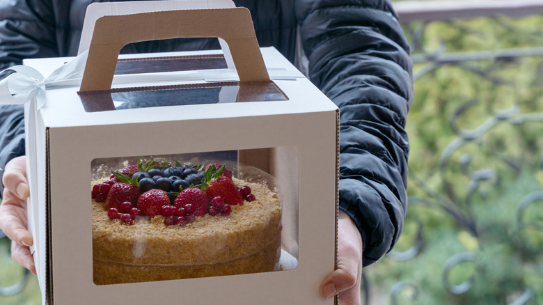 Cake in box being delivered