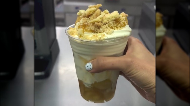 Person holding Costco's Apple Pie Sundae in store