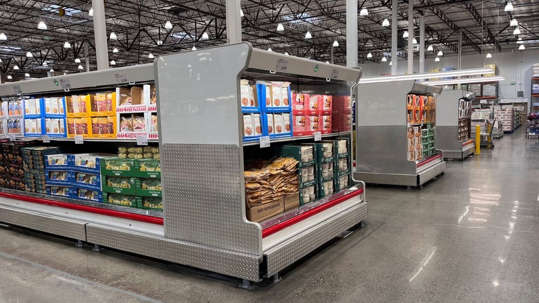 A wide shot of several refrigerated sections in Costco.