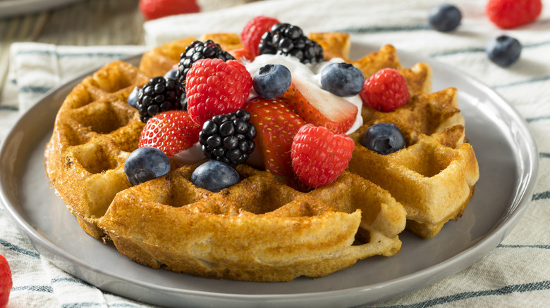 Belgian waffles topped with berries