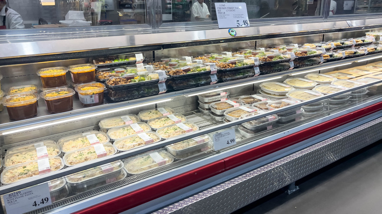 Costco prepared foods refrigerated section filled with take-home items.