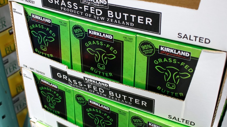 Kirkland Signature grass-fed butter in cardboard boxes on shelf at Costco