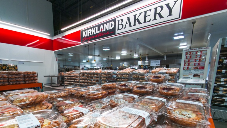 Costco bakery department with food laid out and the sign overhead.