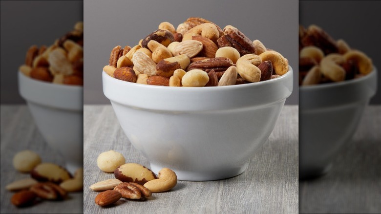 mixed nuts in a white bowl