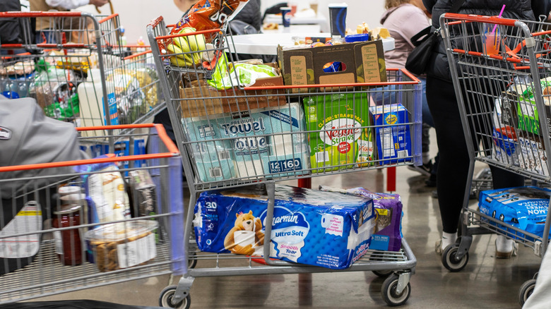 A full Costco shopping cart at checkout