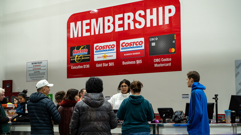 People waiting at Costco membership counter
