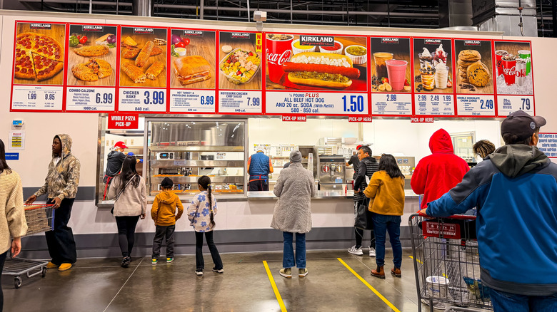 People waiting on line at a Costco food court