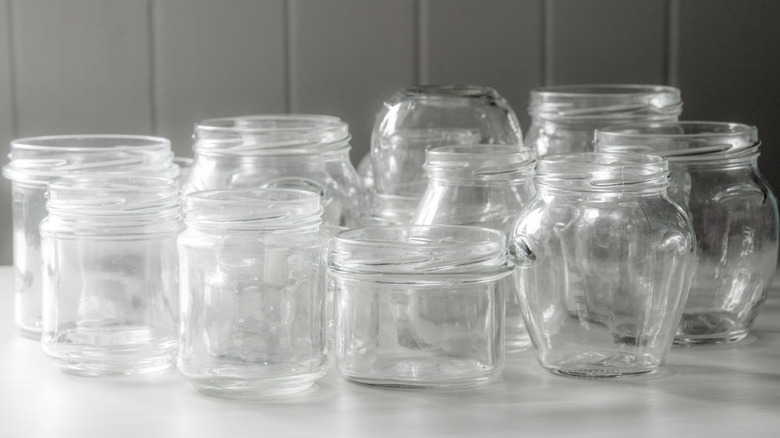 Various shapes of plastic containers with threaded tops next to each other